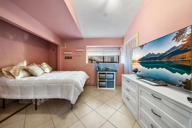 tiled bedroom with vaulted ceiling