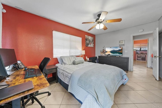 bedroom with multiple windows, ceiling fan, and light tile patterned flooring