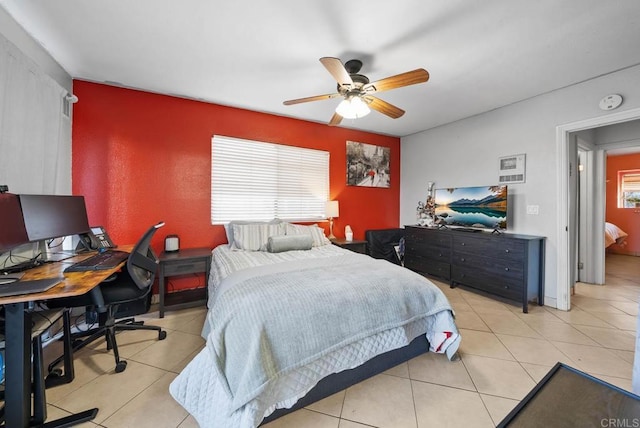 bedroom with ceiling fan and light tile patterned flooring