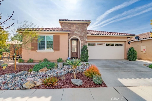 mediterranean / spanish-style home featuring a garage