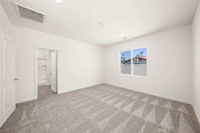 empty room with carpet flooring