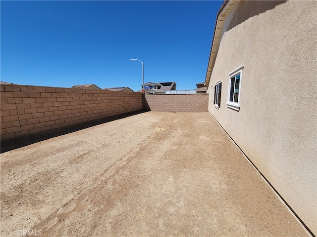 view of yard featuring a patio and a fenced backyard