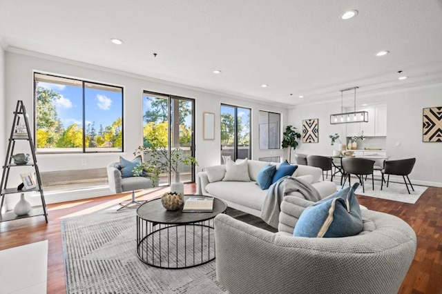 living room with crown molding and hardwood / wood-style flooring