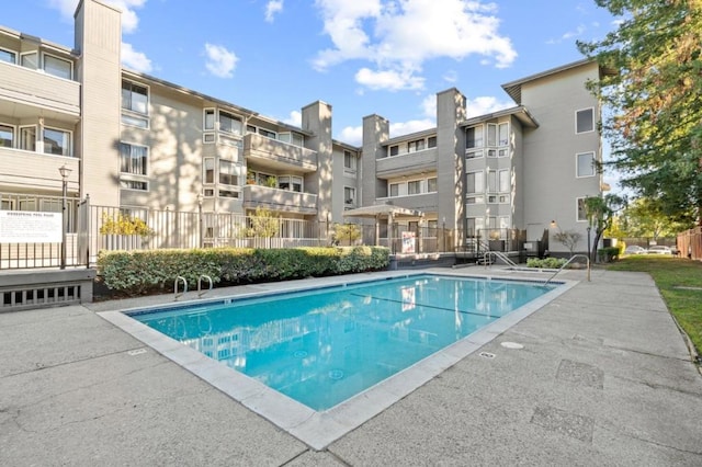 view of swimming pool featuring a patio area