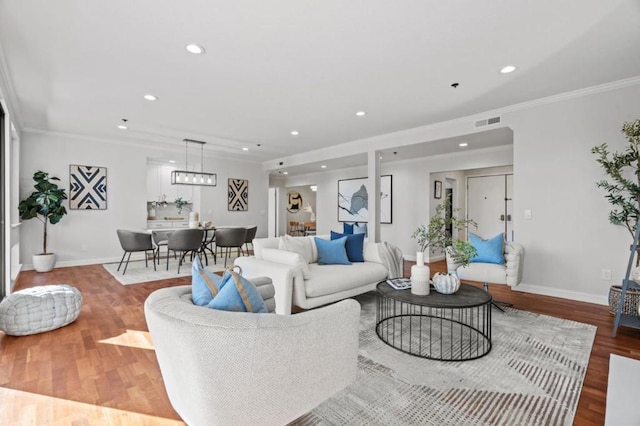 living room featuring ornamental molding and hardwood / wood-style floors