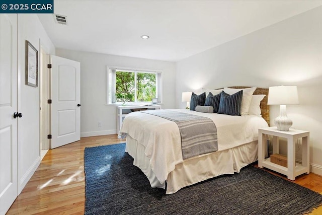 bedroom with light hardwood / wood-style flooring