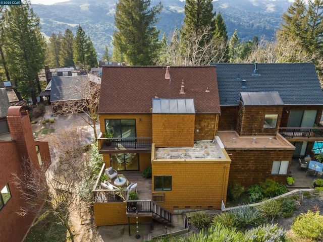 birds eye view of property featuring a mountain view