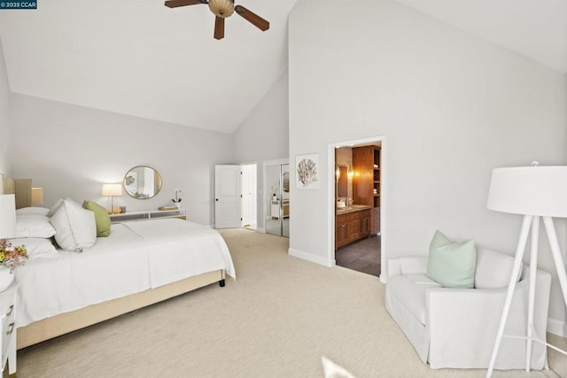 bedroom with ceiling fan, ensuite bath, high vaulted ceiling, and carpet