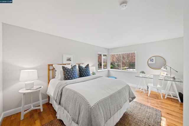 bedroom with wood-type flooring