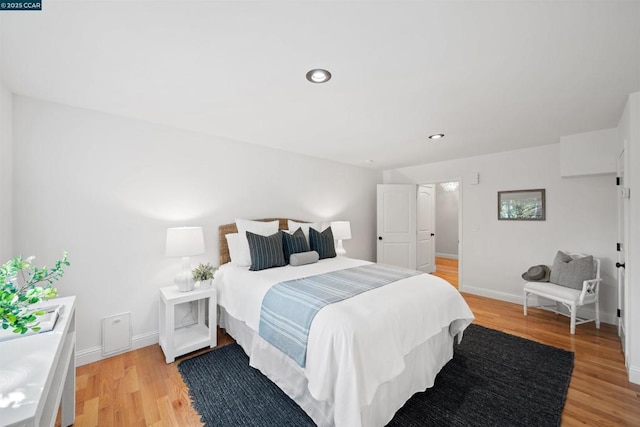 bedroom with light hardwood / wood-style floors