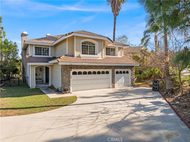 view of front of house featuring a garage and a front yard