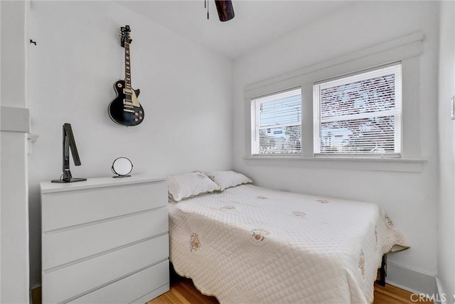 bedroom featuring ceiling fan and light hardwood / wood-style flooring