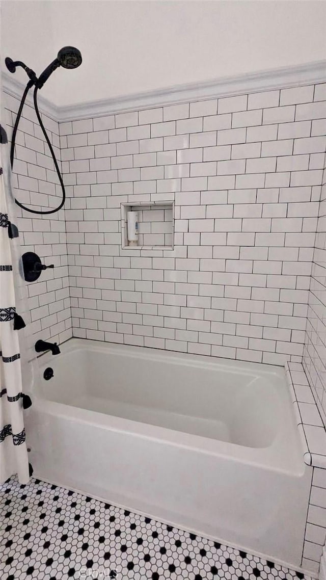 bathroom featuring shower / bath combo and tile patterned floors