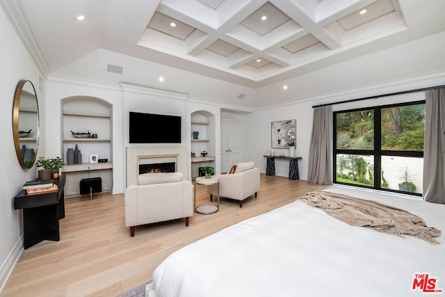 bedroom featuring beam ceiling, crown molding, coffered ceiling, and light hardwood / wood-style floors