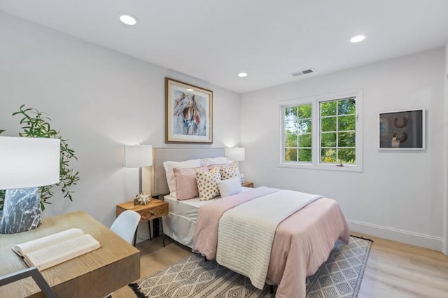 bedroom with light hardwood / wood-style flooring