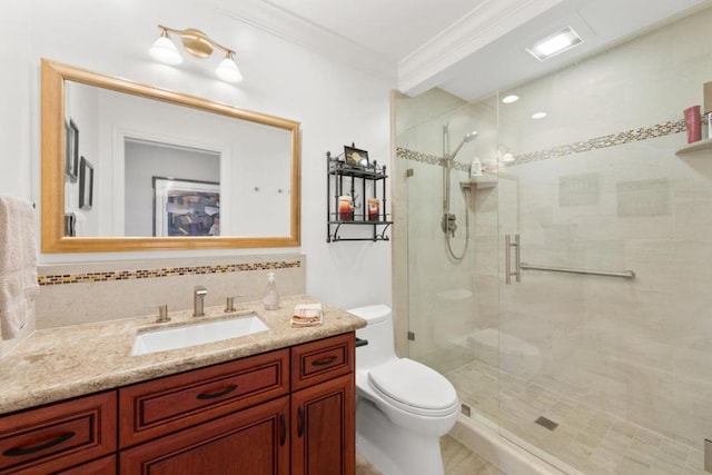 bathroom with toilet, ornamental molding, vanity, a shower with door, and backsplash