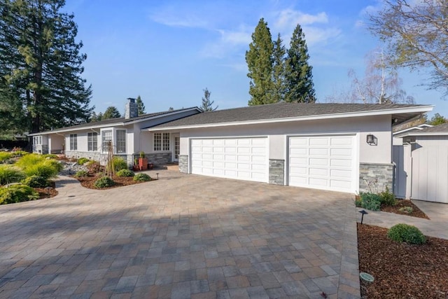 single story home featuring a garage