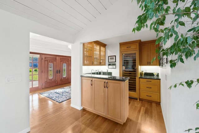 kitchen featuring lofted ceiling and light wood-type flooring