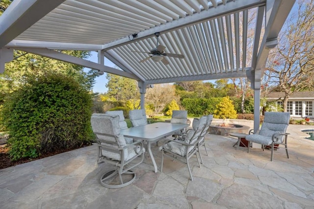 view of patio / terrace featuring ceiling fan and an outdoor fire pit