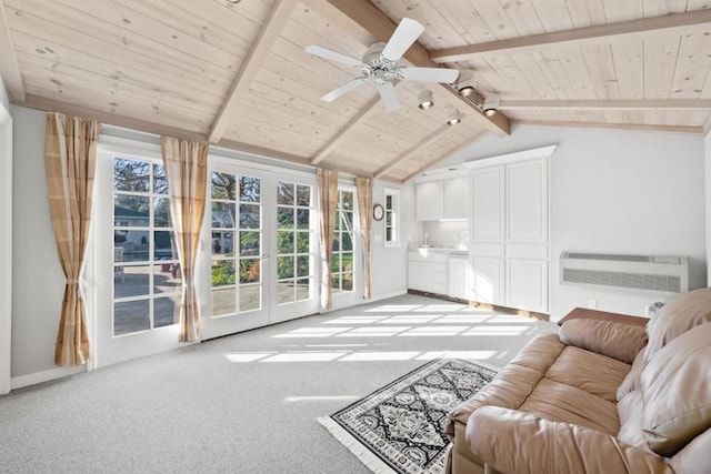 carpeted living room with an AC wall unit, lofted ceiling with beams, ceiling fan, wood ceiling, and french doors