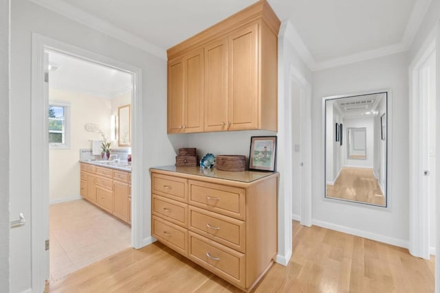 hall featuring light hardwood / wood-style flooring and ornamental molding