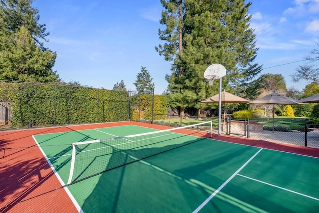 view of sport court featuring tennis court