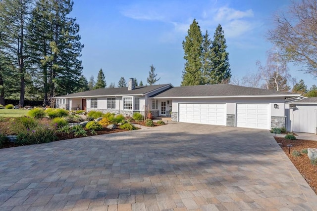 ranch-style home featuring a garage