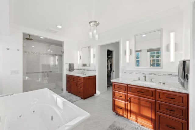 bathroom with vanity, crown molding, tasteful backsplash, and shower with separate bathtub