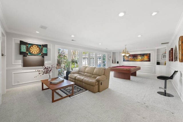 living room with ornamental molding, light colored carpet, pool table, and built in shelves