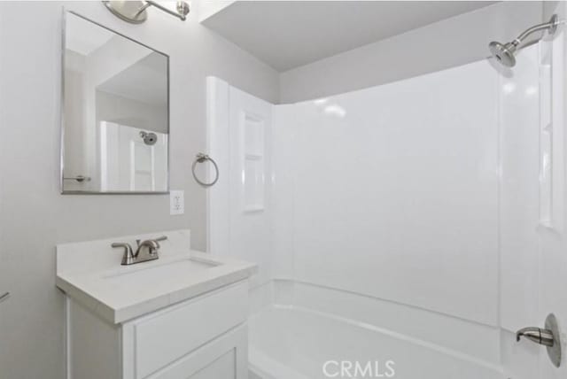 bathroom featuring shower / bath combination and vanity