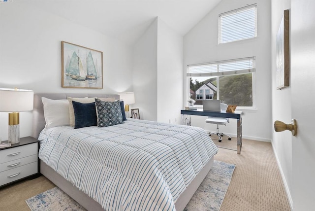 carpeted bedroom with vaulted ceiling