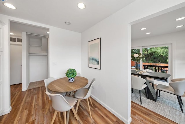 dining room with light hardwood / wood-style flooring