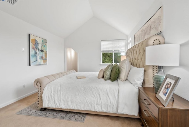 carpeted bedroom featuring vaulted ceiling