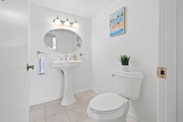 bathroom featuring tile patterned flooring and toilet