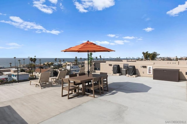 view of patio with a water view