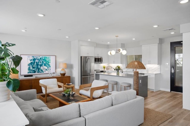 living room with light hardwood / wood-style floors