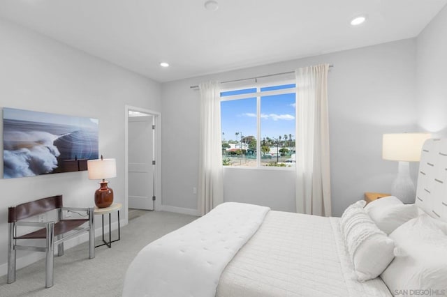 bedroom featuring light carpet