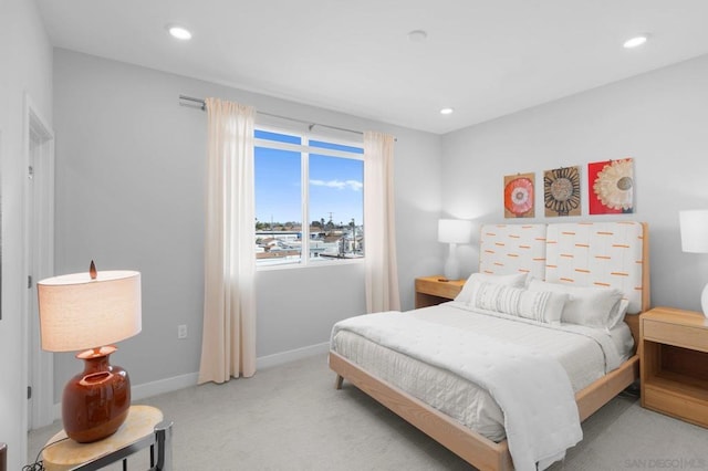 bedroom featuring light colored carpet