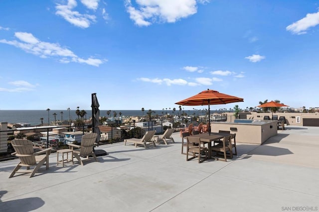 view of patio with a water view