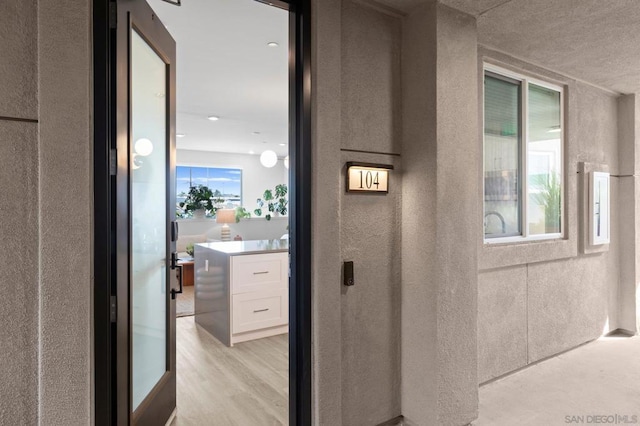 corridor featuring light hardwood / wood-style flooring