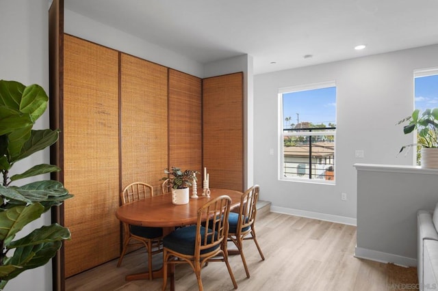 dining area with light wood-type flooring