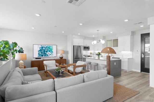 living room with light hardwood / wood-style floors