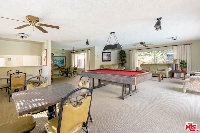 recreation room featuring ceiling fan, light colored carpet, a textured ceiling, and pool table