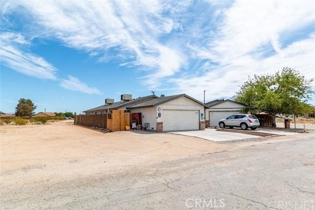 single story home featuring a garage