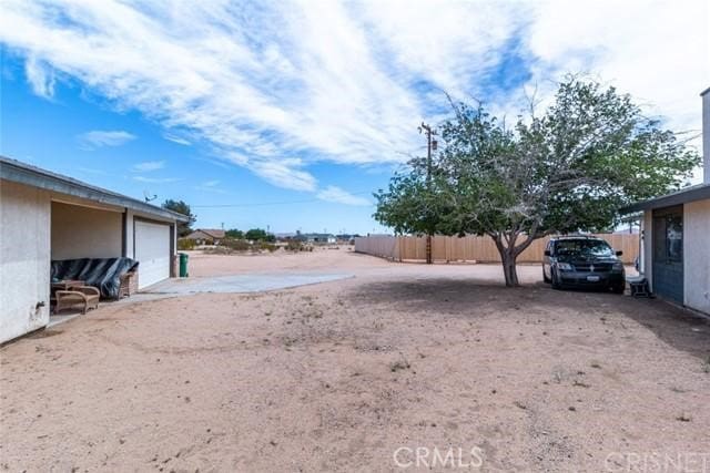 view of yard featuring a garage