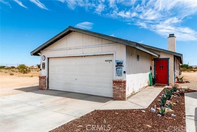 single story home with a garage