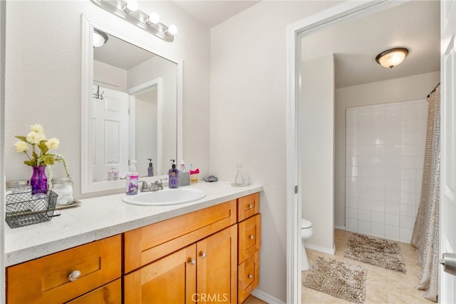 bathroom with a shower with curtain, vanity, tile patterned floors, and toilet