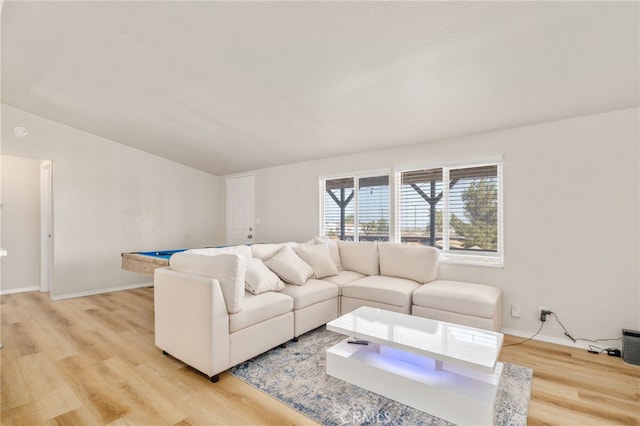 living room featuring light hardwood / wood-style floors and billiards