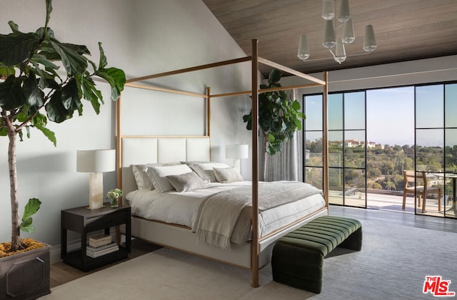 bedroom with access to exterior and wooden ceiling