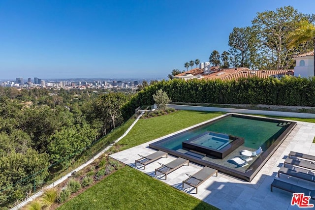 view of pool featuring a yard and a patio